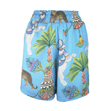 Load image into Gallery viewer, Colorful shorts with animal and plant pattern on a blue background
