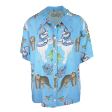 Load image into Gallery viewer, Blue shirt with animal print on a white background
