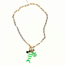 Load image into Gallery viewer, Gold chain necklace with green fish charm on a white background
