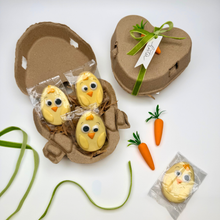 Load image into Gallery viewer, Easter-themed cookies in a heart-shaped box with decorative carrots and ribbons on a white background.
