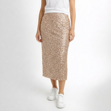 Load image into Gallery viewer, Person wearing a sparkly beige skirt on a white background
