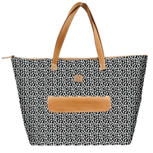 Load image into Gallery viewer, Tote bag with black and white pattern and brown handles and pocket on a white background
