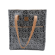 Load image into Gallery viewer, Tote bag with black and white pattern and tan handles on a white background
