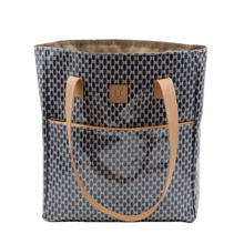 Load image into Gallery viewer, Patterned tote bag with brown leather handles on a white background
