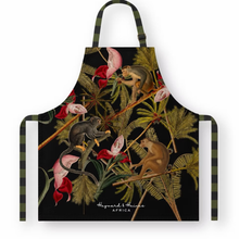 Load image into Gallery viewer, Apron with monkey and floral design on a black background
