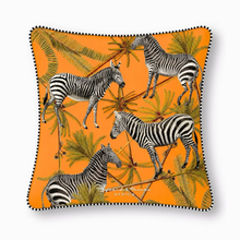 Load image into Gallery viewer, Decorative cushion with zebras and palm trees on an orange background
