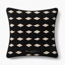 Load image into Gallery viewer, Black decorative cushion with beige geometric pattern on a white background

