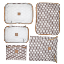 Load image into Gallery viewer, A set of five patterned travel packing cubes and a matching sleeve in a brown and white geometric design with tan leather-like logo patches, arranged on a plain white background.

