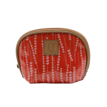 Load image into Gallery viewer, A orange-red zippered cosmetic pouch with a pink vertical dotted pattern, featuring a tan leather patch with the brand name 'IY APPAREL' on a white background.
