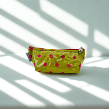 Load image into Gallery viewer, Green pouch with pink polka dots on a light background
