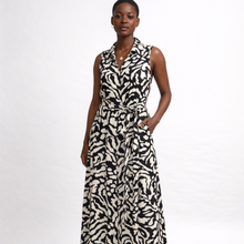Load image into Gallery viewer, Woman wearing a sleeveless dress with a black and white pattern on a white background
