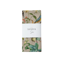 Load image into Gallery viewer, Table runner with floral and bird design on a beige background, featuring the brand 'Safari &amp; Sea'.
