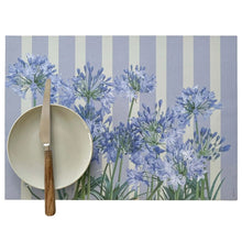 Load image into Gallery viewer, Placemat with blue floral design on a striped background
