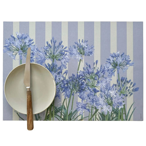 Placemat with blue floral design on a striped background