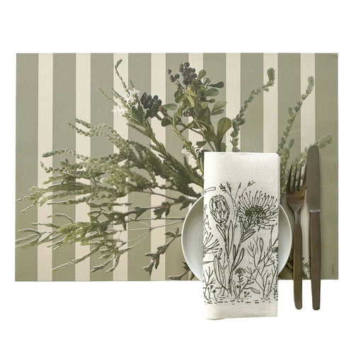 Placemat with striped floral pattern, napkin with floral design, and cutlery on a white background