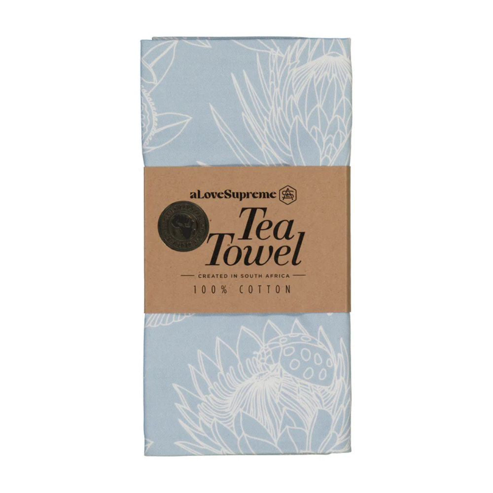 Blue & white floral print tea towel with 'aLoveSupreme' branding on a white background