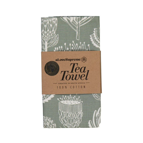 Sage green Tea towel with white floral pattern and 'a love Supreme' branding on a white background