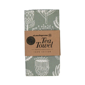 Sage green Tea towel with white floral pattern and 'a love Supreme' branding on a white background