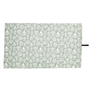 A Love Supreme patterned quick dry towel with white leaf design on a light green background