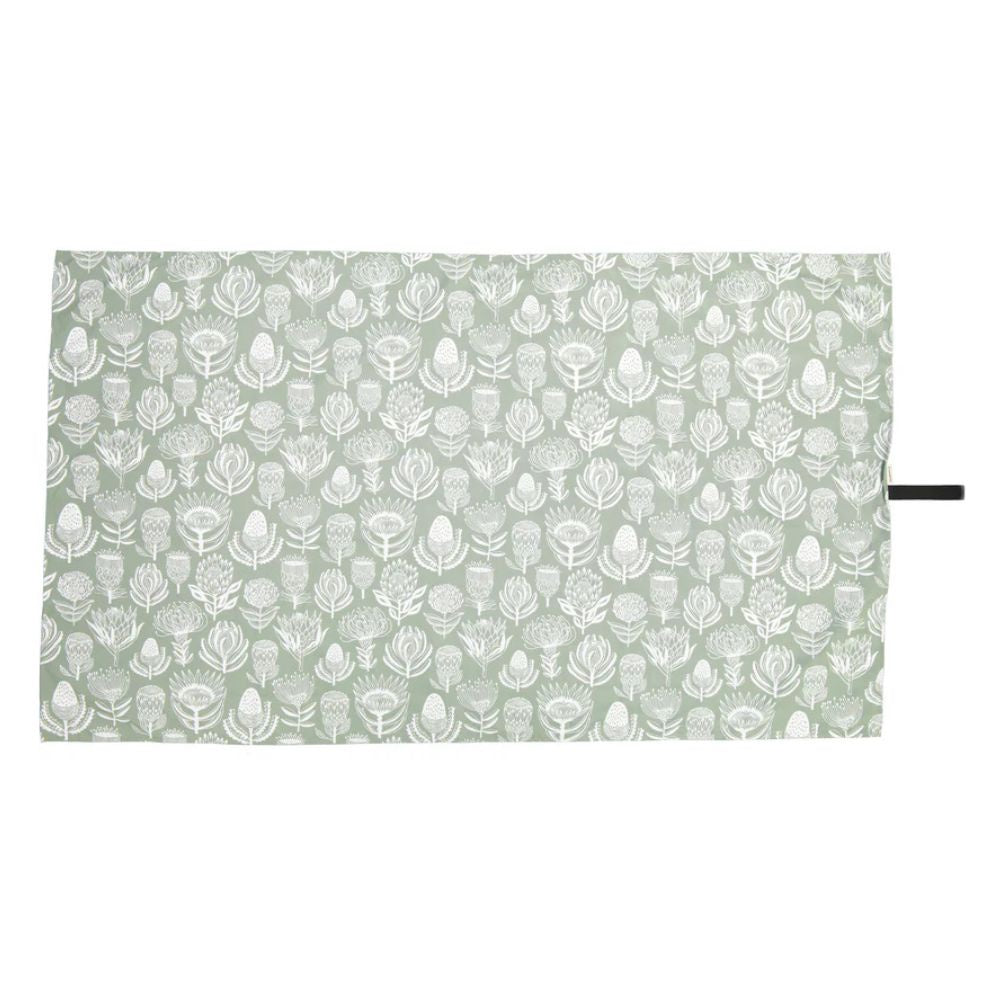 A Love Supreme patterned quick dry towel with white leaf design on a light green background
