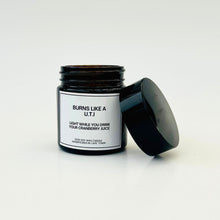 Load image into Gallery viewer, Candle in a black jar with a white label on a light gray background
