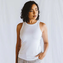 Load image into Gallery viewer, Woman wearing a white tank top against a plain background
