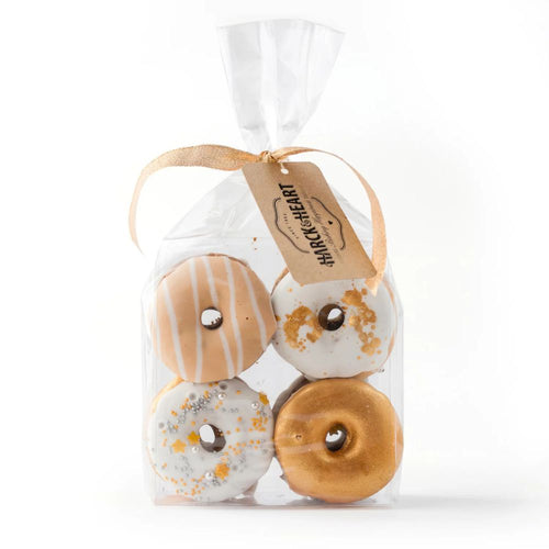 Packaged donut-shaped Harck & Heart gingerbread biscuits on a white background
